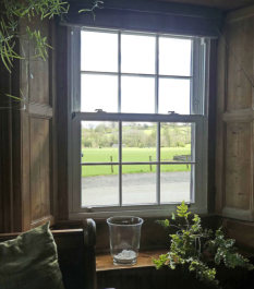 The window installers took great care maintaining the original pine shutters and window framing 
